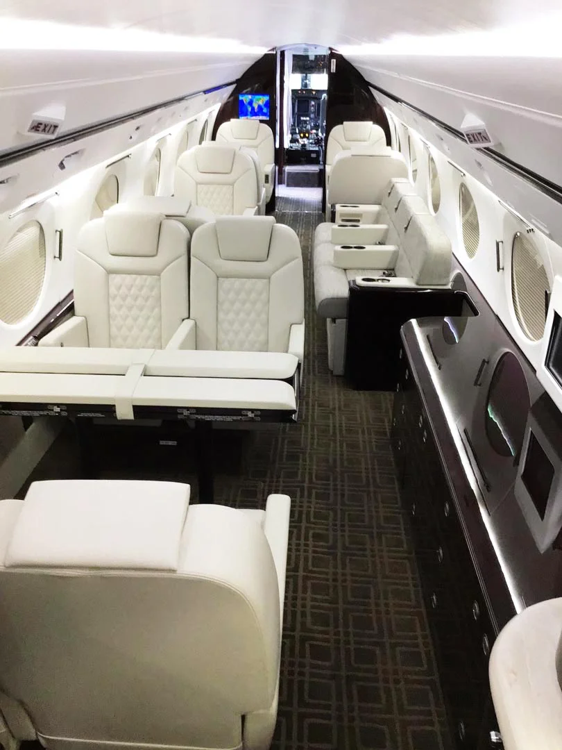 Photo of an empty aircraft cabin with new, modern upholstery.