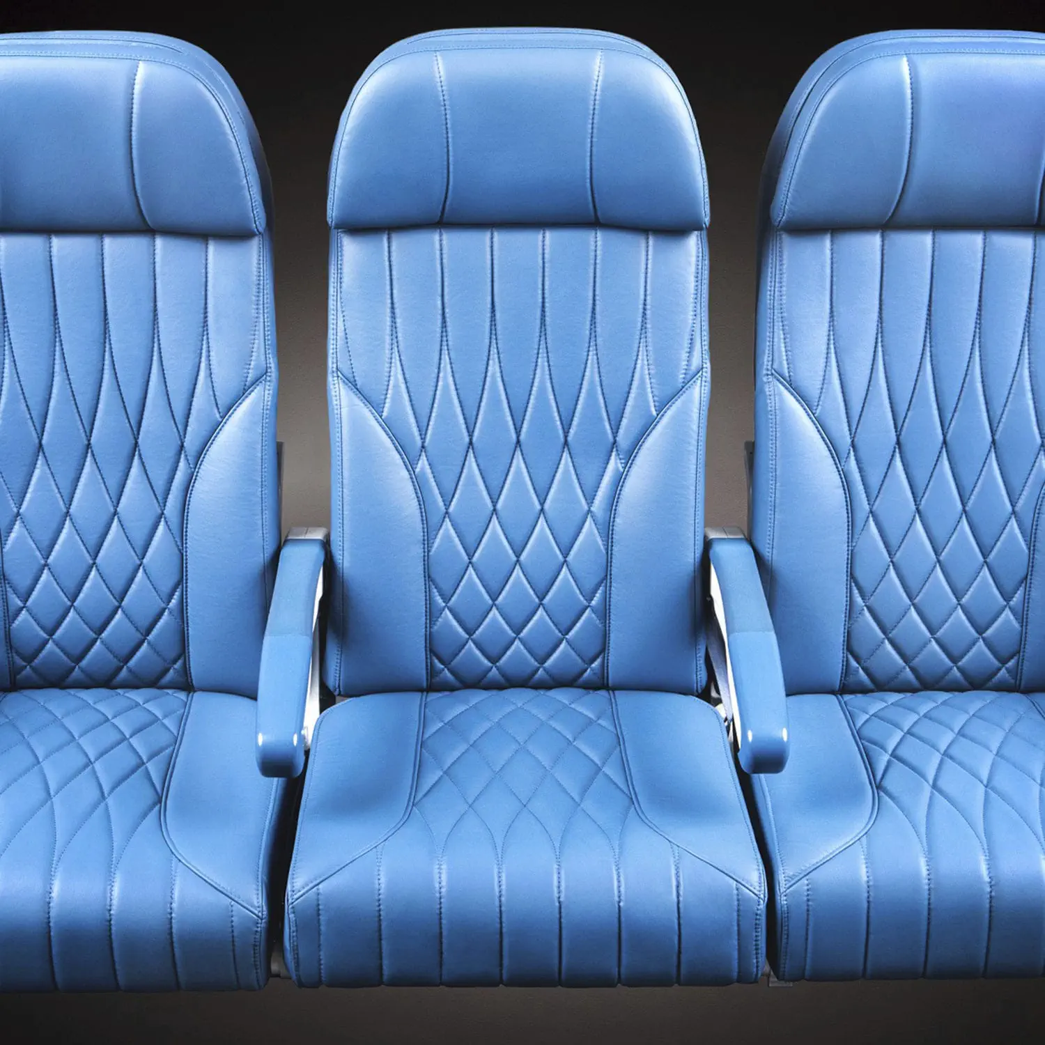 Interior of a private jet showing luxurious leather seats and high-end finishes.