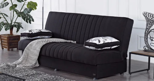 Modern armless sofa bed transforming a living room.