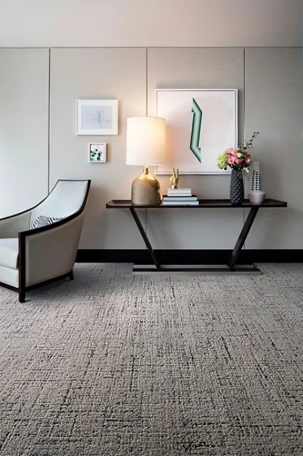 Brightly lit room beautifully contrasted with a sisal carpet.
