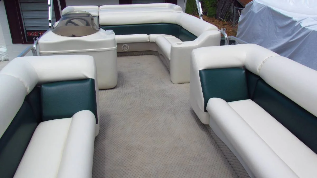 Classic white upholstery with navy blue piping on a yacht.