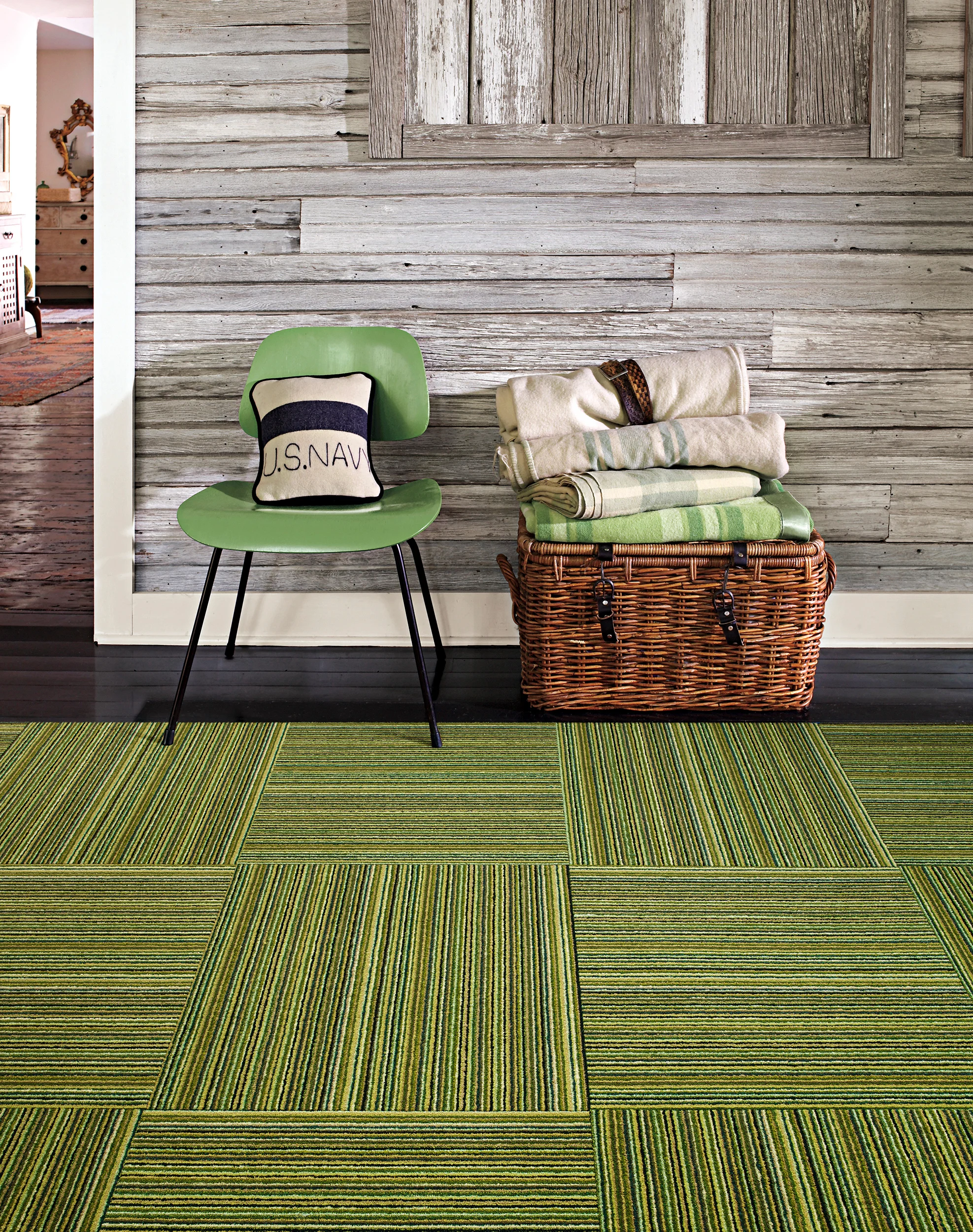 Lime green carpet against a dark wood floor