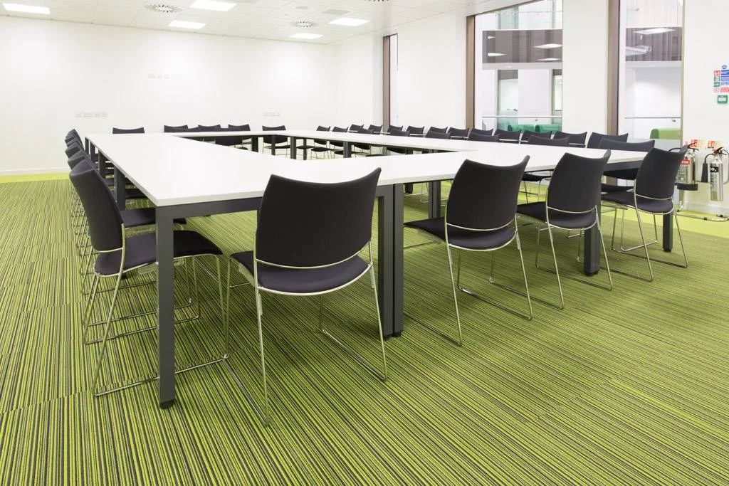 Layered lime green carpet with geometric patterns