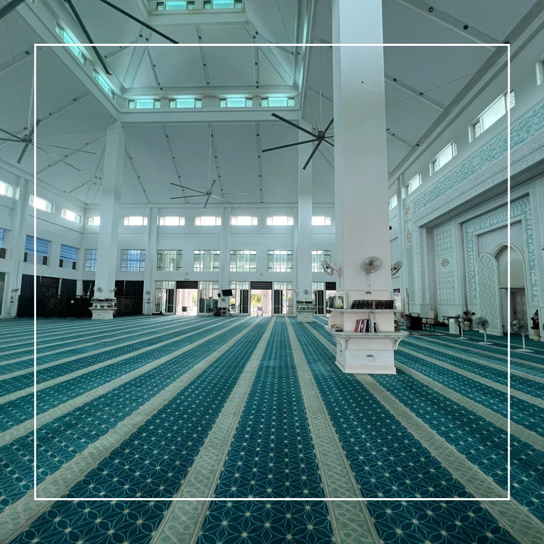 Harmonious colors of a masjid carpet, creating a calming prayer space.