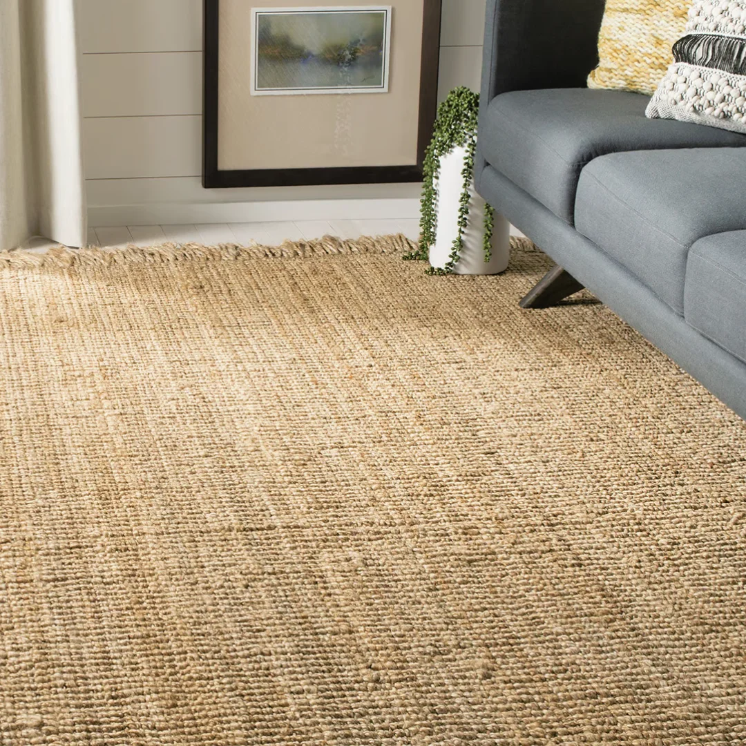 Sisal carpet laid under a dining table, complementing the room's aesthetics.