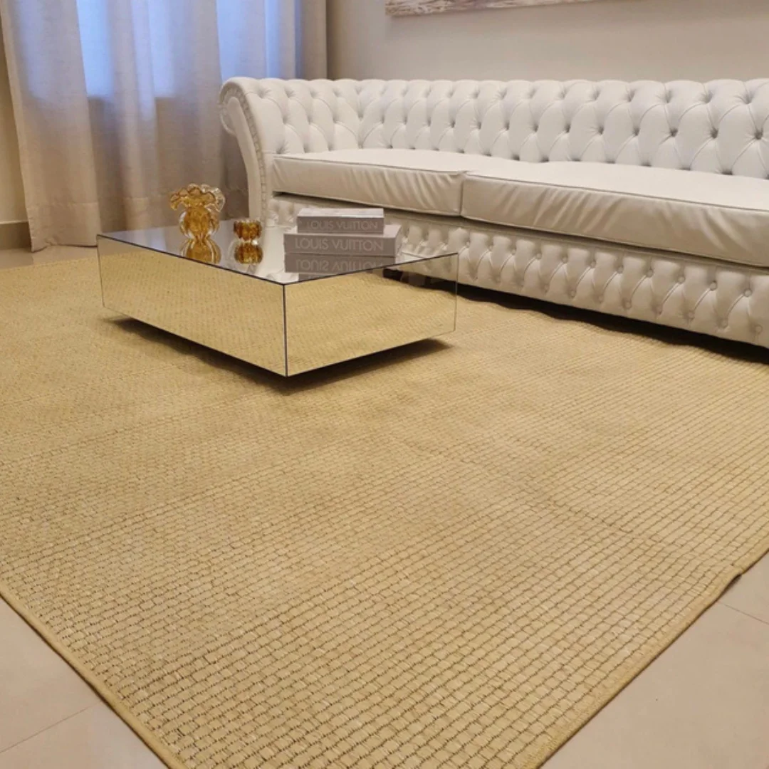 Close-up of a sisal carpet corner showing its neat finish.